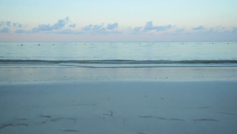 Calm-waves-on-beach-at-sunset
