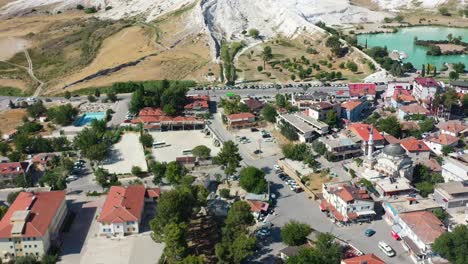 aerial-panning-shot-of-residential-buildings-in-a-Pamukkale-Turkey-famous-for-its-white-mineral-rich-mountains-and-thermal-pools