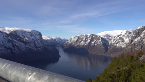 Magnificent-panoramic-view-over-Aurlandsfjord-in-Sognefjorden-Norway---Railing-of-Stegastein-vewpoint-in-foreground