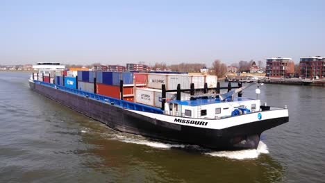 Missouri-Ship-Carrying-Shipping-Containers-Along-River-Noord