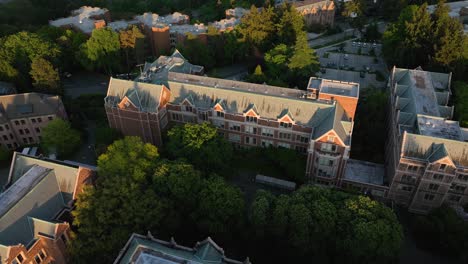 Orbiting-aerial-of-the-University-of-Washington's-Communication-building-during-golden-hour