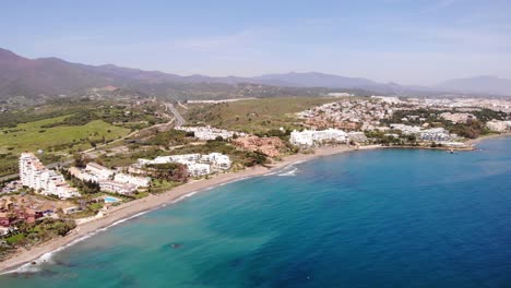 Aerial-View-Of-Beach-With-Apartments-And-Hotels-At-Estepona-In-The-Costa-del-Sol