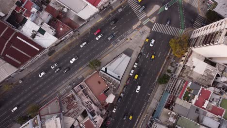 Aerial-top-down-view-of-vehicular-traffic-on-busy-roads-of-Cordoba-Avenue-fork-in-Buenos-Aires,-Argentina