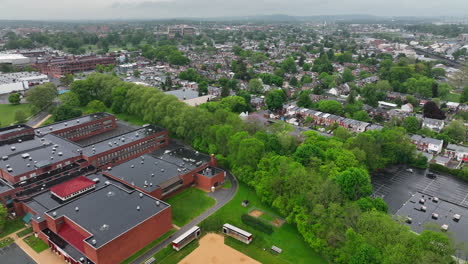 Aerial-reverse-view-of-Lancaster-city-and-high-school