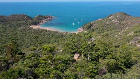Magnetic-Island-landscape-lookout-aerial-revealing-Arthur-Bay-above-boulders-and-trees,-Queensland