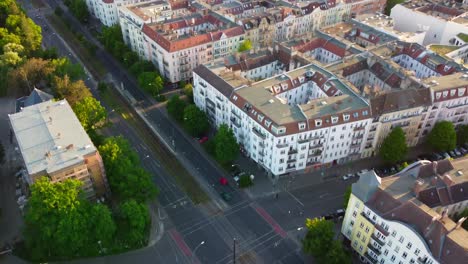 Overview-of-Prenzlauer-berg-Allee-with-television-tower-Multi-family-houses-Amazing-aerial-view-flight-tilt-down-drone-footage
of-Berlin-Summer-2022