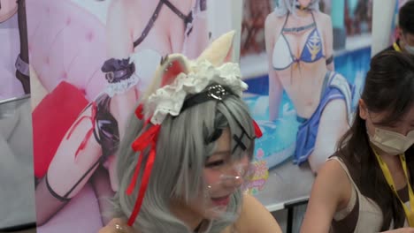 A-participant-dressed-up-cosplayer-takes-selfies-and-photos-for-visitors-during-the-Ani-com-and-Games-ACGHK-exhibition-event-in-Hong-Kong