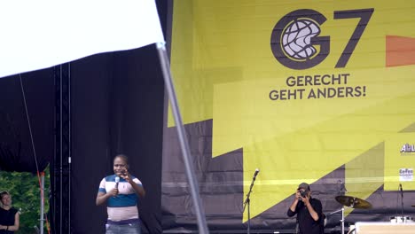 Black-african-speaker-gives-speech-about-global-injustice-and-wrong-policies-of-world-powers-at-protest-demonstration-against-G7-summit-in-munich