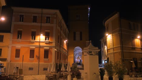Cinematic-view-of-famous-and-historic-architecture,-windows,-buildings-and-city-center-in-Cesena-at-night-in-Northern-Italy