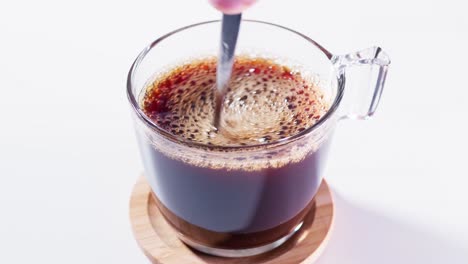 Teaspoon-stirring-coffee-in-a-cup