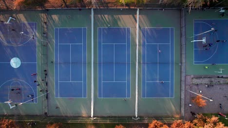 Static-overhead-view-of-a-group-of-people-playing-tennis-at-Parque-Araucano,-Las-Condes,-Santiago,-Chile