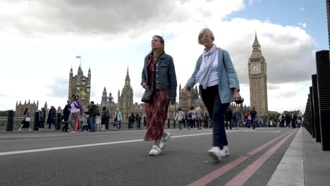 Low-Angle-View-On-Closed-Westminster-Bridge-Busy-People-Walking-Across-It-And-Parliament-In-The-Background