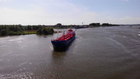 Aerial-View-Of-Amadeus-Titanium-Chemical-Tanker-Approaching-On-Oude-Maas-On-Sunny-Day-In-Zwijndrecht