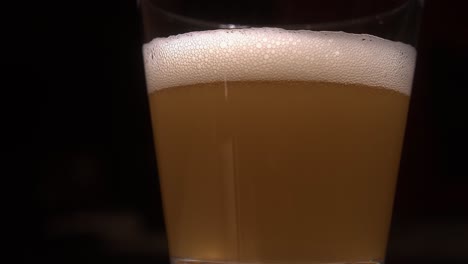 Carbonated-bubbles-form-a-head-atop-glass-of-pale-lager-beer