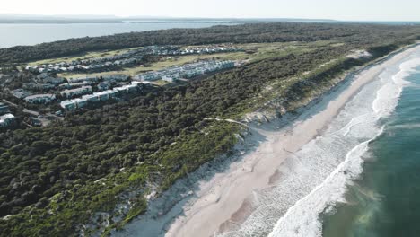 Panning-drone-shot-from-Tuggerah-Lake-and-Magenta-Shores-to-reveal-Magenta-Beach