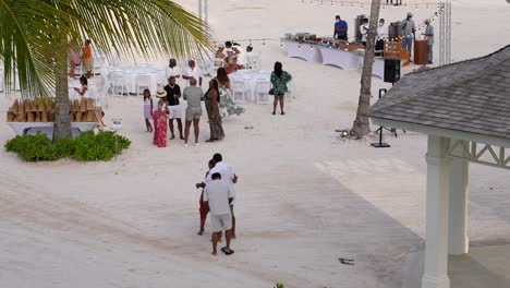 Outdoor-party-gathering-on-sandy-beach-in-Caribbean