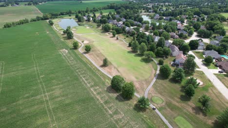 golf-course-hole-fly-over,-aerial-drone-blimp-view