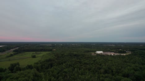An-panoramic-view-of-a-forest-glade-at-sunset-time