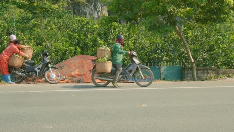 Tracking-Shot-Of-A-Gentlemen-Transporting-Crates-Of-Fresh-Produce-On-A-Motorbike-At-The-Chi-Lang-district,-Lang-Son-province,-Vietnam