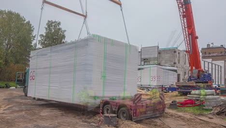 Time-lapse-shot-of-worker-and-crane-on-construction-build-a-container-prefabricated-house
