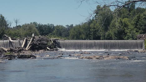 Spiil-way-and-dam-across-the-Haw-River-in-Burlington,-NC-ona-hot-summer-day