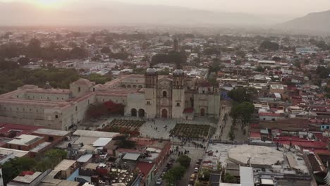 Aerial-is-flying-around-Santo-Domingo-Temple-during-early-morning,-Oaxaca-Mexico