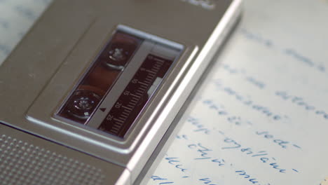 The-microcassette-in-the-recorder-plays-the-tape-slowly