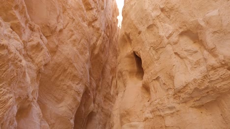 Looking-Up-At-Eroded-Sandstone-Canyon-Walls-With-Cavity-Hole-On-The-Right