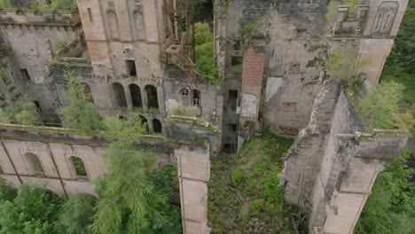 Tilting-Aerial-Shot-Of-The-Abandoned-Lennox-Castle