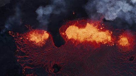 Fiery-hot-molten-lava-spewing-from-earth-mantle,-active-fissure-volcano