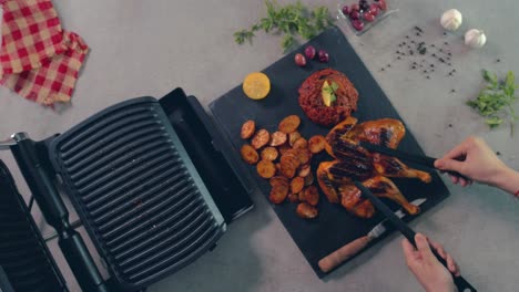 An-aerial-view-of-chicken-which-is-being-grilled-on-a-grilling-machine