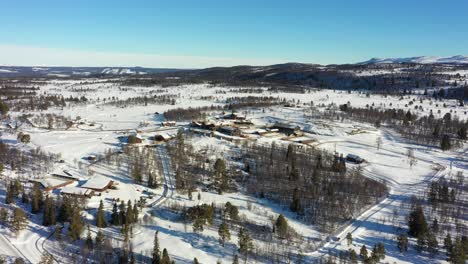 Langedrag-nature-park-panoramic-aerial-view-during-sunny-winter-morning---Rotating-slowly-around-animal-park-at-a-distance---Norway