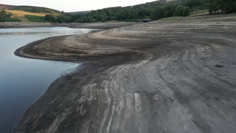 Aerial-drone-flight-around-Goyt-Valley-Errwood-Reservior-showing-the-low-water-levels-caused-by-heatwave-Part-1