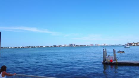 A-view-of-the-clear-blue-sea-from-the-dock-of-Bellaire-Causeway-bridge-in-Belleair-Beach,-Florida