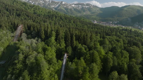 Three-Ski-Jump-Ramps-On-Lush-Green-Forest-Mountain-In-Bakuriani-Ski-Resort-In-Georgia