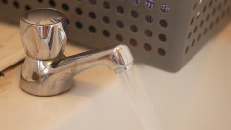 Static-shot-of-chrome-tap-running-hot-water-bath-with-steam
