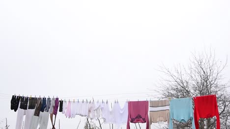 Clothes-hanging-on-an-outside-washing-line-drying-naturally-under-an-overcast-sky