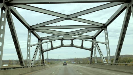 Passenger-point-of-view-of-a-bridge-overhead-then-tilt-to-reveal-the-road-ahead