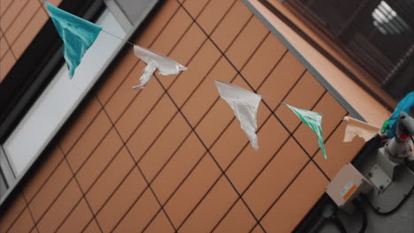 Slow-motion-shot-of-flags-bunting-blowing-in-the-breeze-in-Belfast,-Northern-Ireland