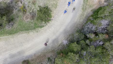 Top-down-aerial-view-of-a-group-of-back-packers-on-a-hiking-trail-in-the-mountains