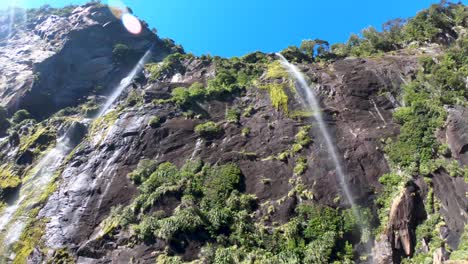 Inside-beautiful-waterfalls-while-cruising-around-Milford-Sound-in-New-Zealand