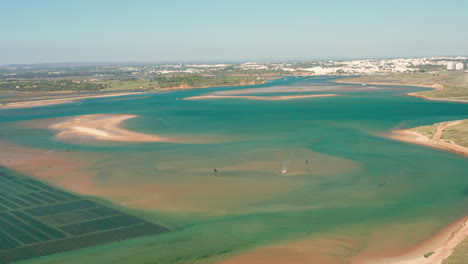 Aerial:-Aquaculture-and-kitesurfing-in-the-lagoon-of-Alvor-in-Portugal