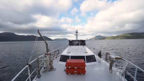 SLOWMO---Looking-back-from-front-deck-of-boat-on-ocean-in-New-Zealand