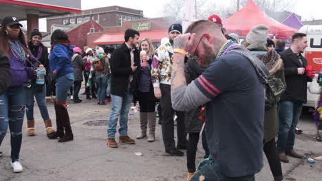 A-young-man-dancing-among-a-crowd-of-people-at-a-Mardi-Gras-celebration