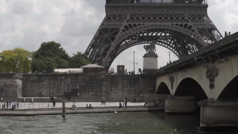 SLOW-MOTION:-Boat-Cruise-on-river-Seine-in-Paris-with-Eiffel-Tower-View,-France