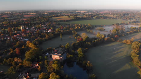 Aerial-footage-of-Dedham-featuring-the-village-and-church-in-the-early-morning-with-mist-lying-in-the-fields