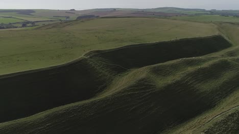 Aerial-tracking-along-the-northern-side-of-the-iron-age-hill-fort-known-as-Maiden-Castle