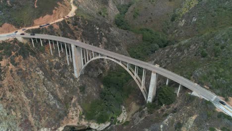 Aerial-Drone-Stock-Video-of-Bixby-Bridge-Highway-with-water-and-shore-below-in-Big-Sur-Monterrey-California