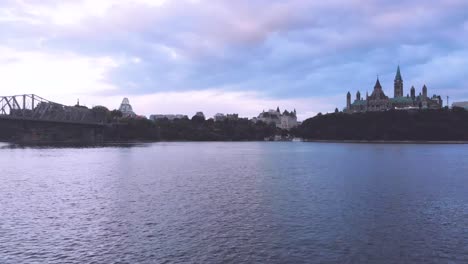Evening-Aerial-Footage-Above-The-Ottawa-River-Facing-The-Parliament-Buildings