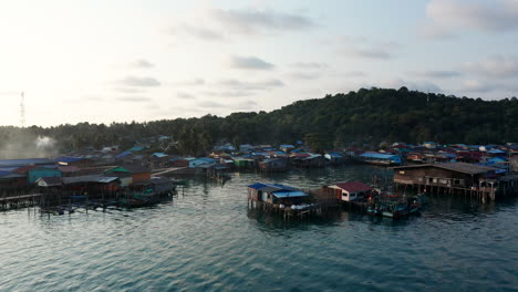 Aerial-drone-footage-flying-around-a-floating-village-in-an-island-in-Cambodia